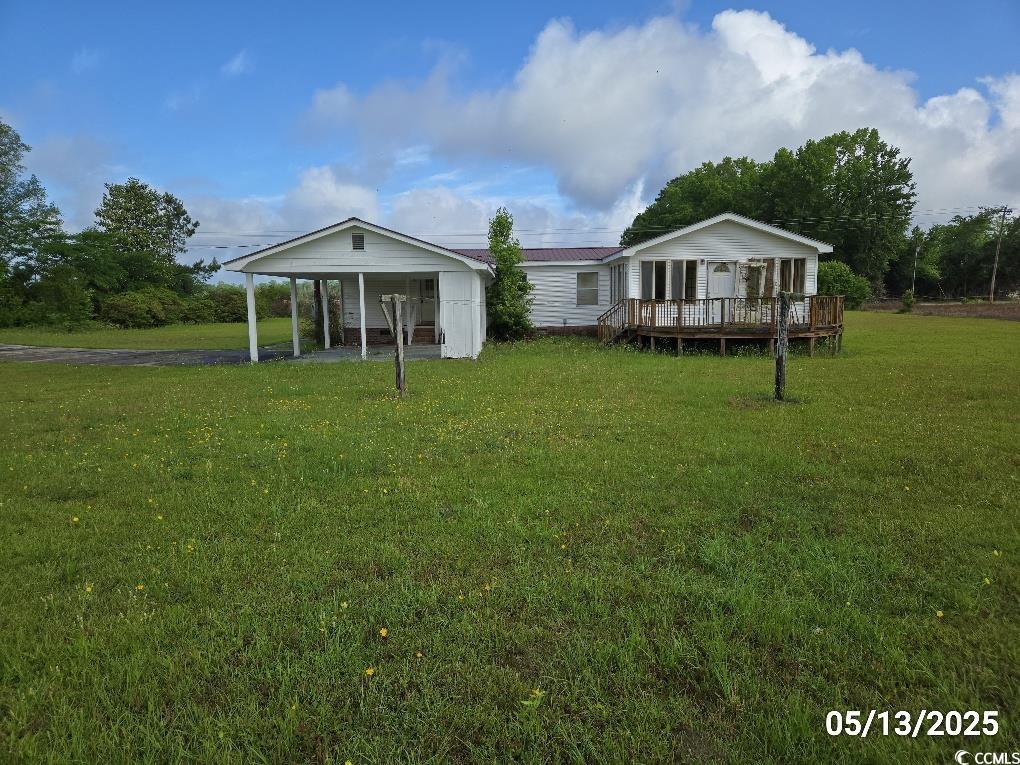 11 Lilac Lane Nesmith, SC 29580 - Photo 12 of 34 Back of property with a lawn, a wooden deck, and a