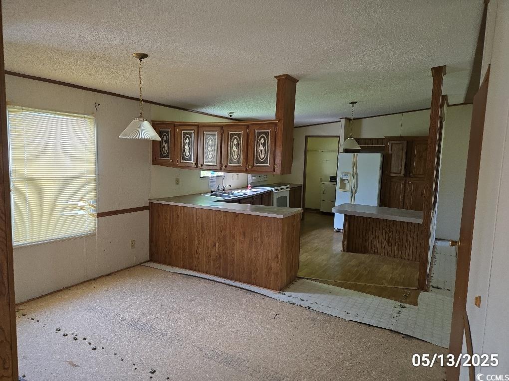 11 Lilac Lane Nesmith, SC 29580 - Photo 23 of 34 Kitchen with white fridge with ice dispenser, a pe