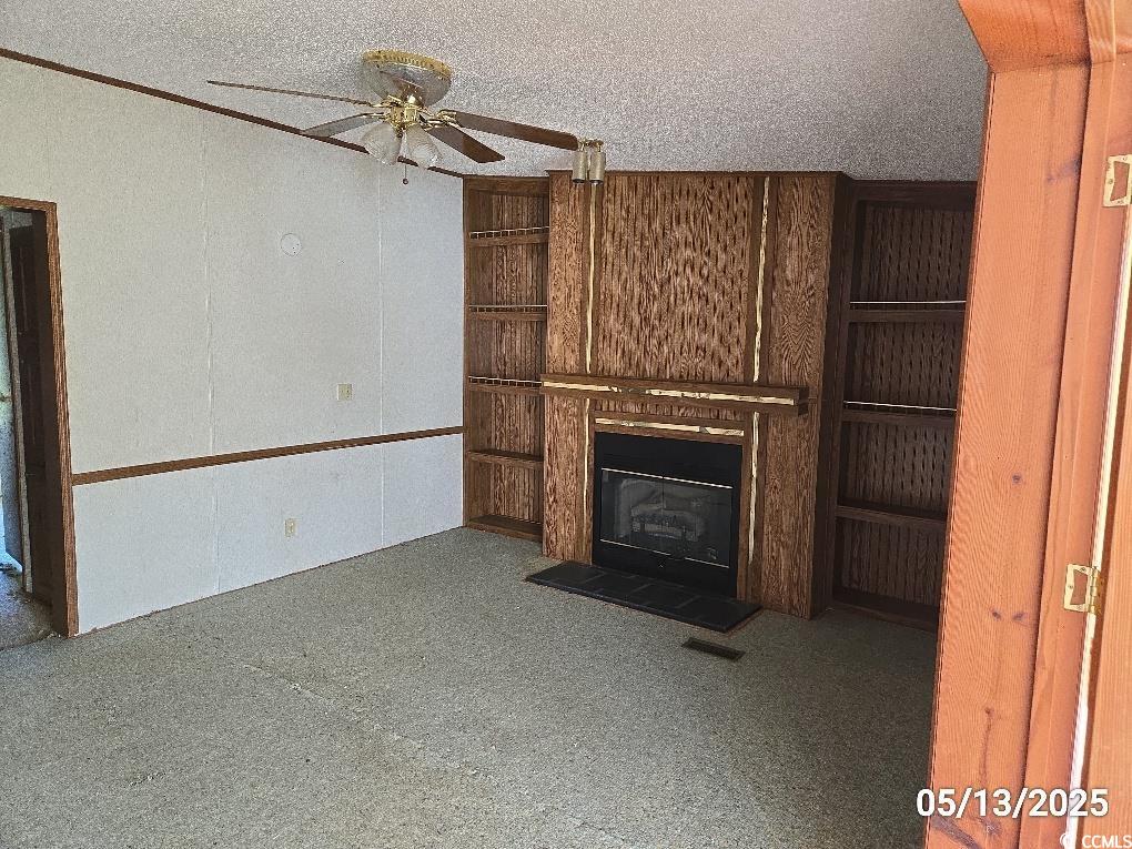 11 Lilac Lane Nesmith, SC 29580 - Photo 27 of 34 Unfurnished living room featuring ceiling fan, a g