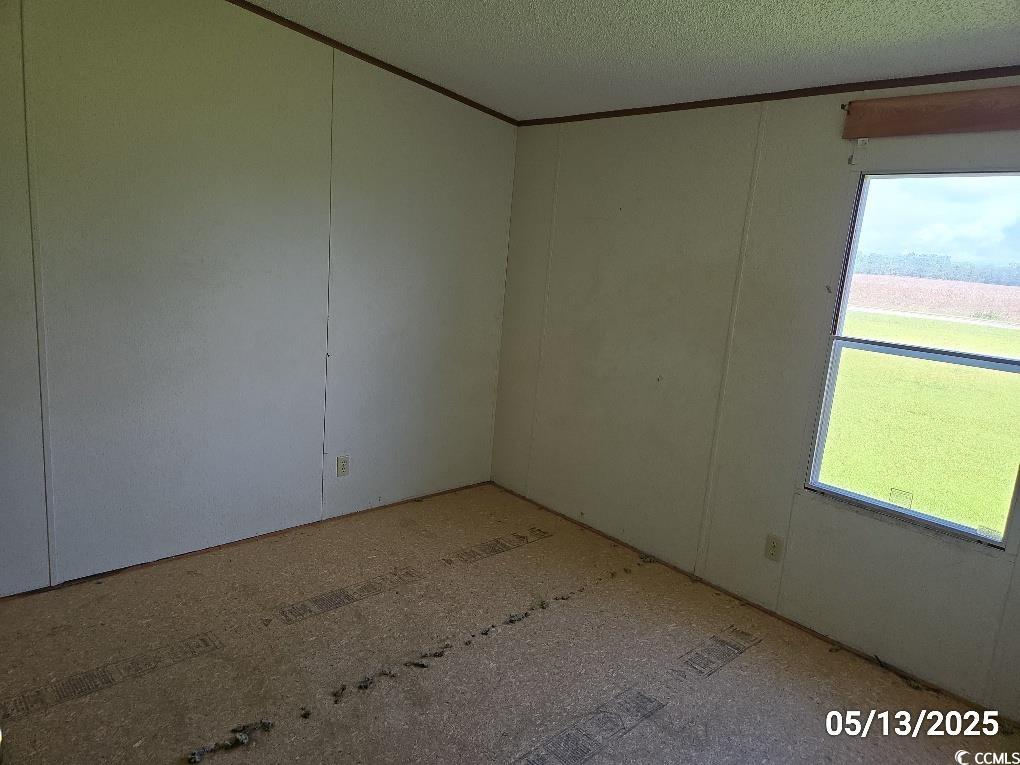 11 Lilac Lane Nesmith, SC 29580 - Photo 30 of 34 Unfurnished room with a textured ceiling and ornam
