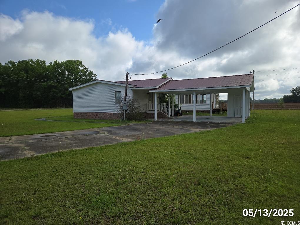 11 Lilac Lane Nesmith, SC 29580 - Photo 3 of 34 View of front of house with driveway, a front yard