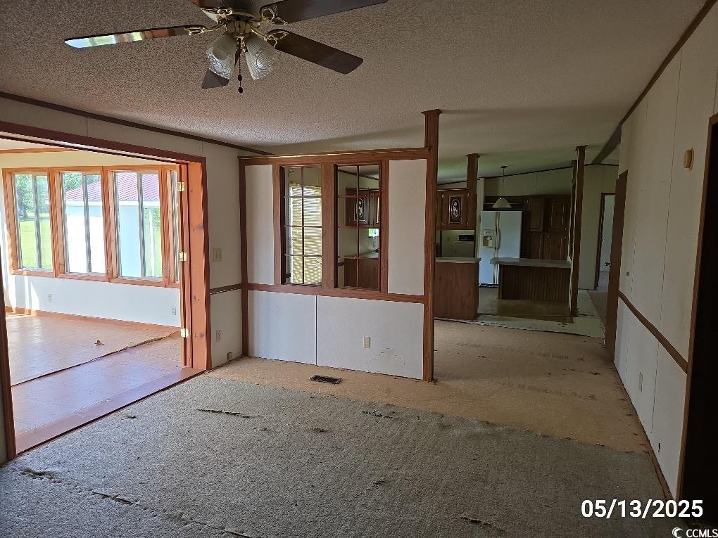 11 Lilac Lane Nesmith, SC 29580 - Photo 34 of 34 Empty room featuring ceiling fan and a textured ce