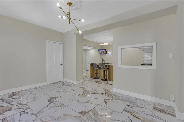 a view of a room with cabinet and windows