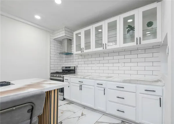 a kitchen with a sink and cabinets