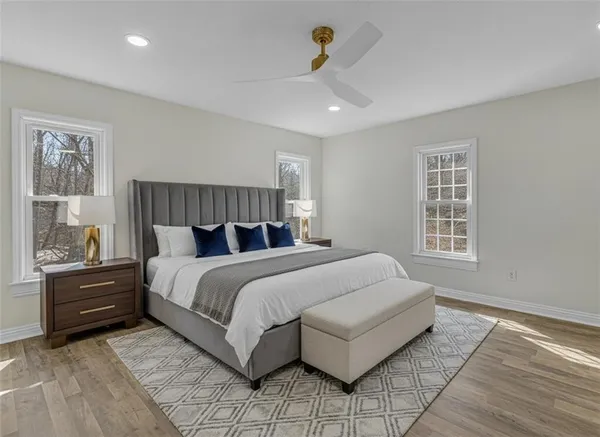 a bedroom with a bed and window