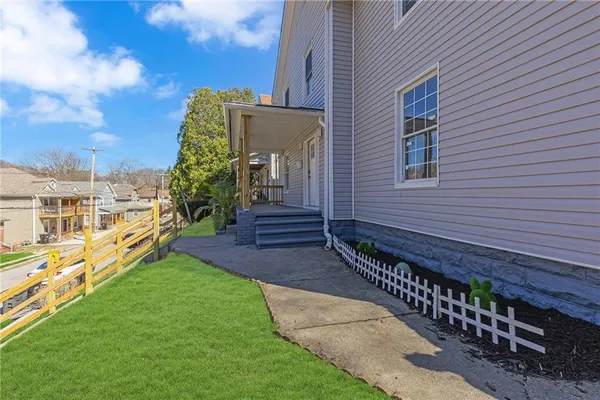 a view of a pathway with a house in the background