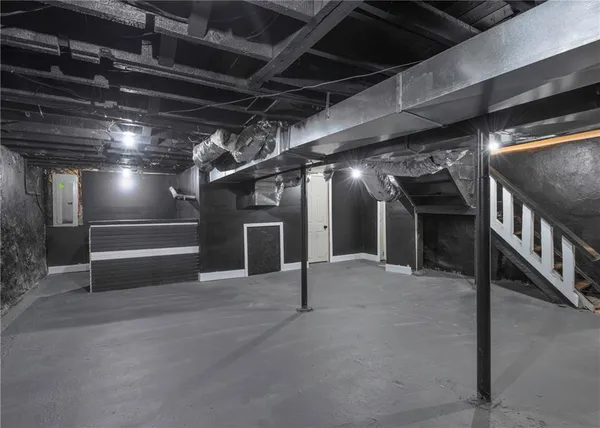 a view of an empty room with wooden roof