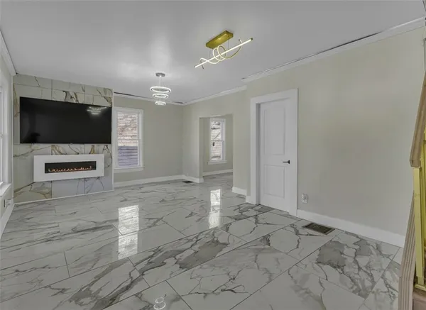 wooden floor in an empty room with a fireplace