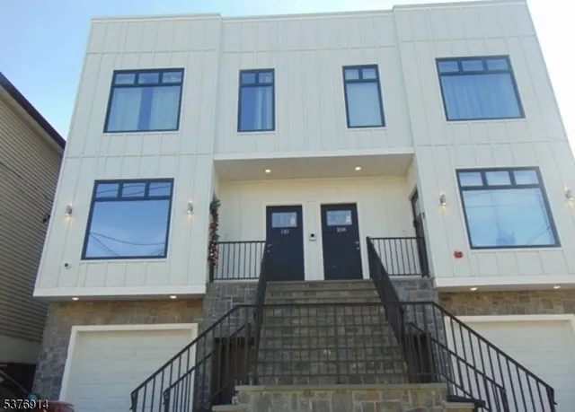 a view of a hallway with a large tree and wooden floor