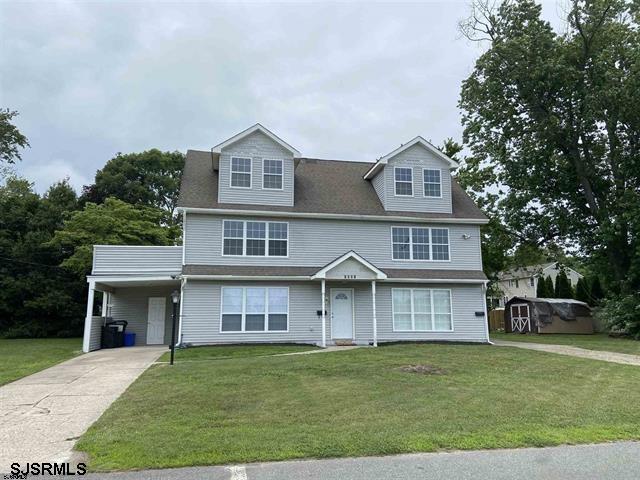 1221 Wabash Avenue, Unit B Linwood, NJ 08221 - Photo 1 of 11 a front view of a house with a garden