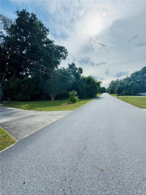 Tbd Southeast 126th Place Belleview, FL 34420 - Photo 3 of 4 a view of a golf course with a lake