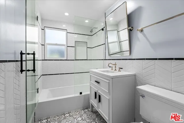a bathroom with a sink a toilet and a bathtub