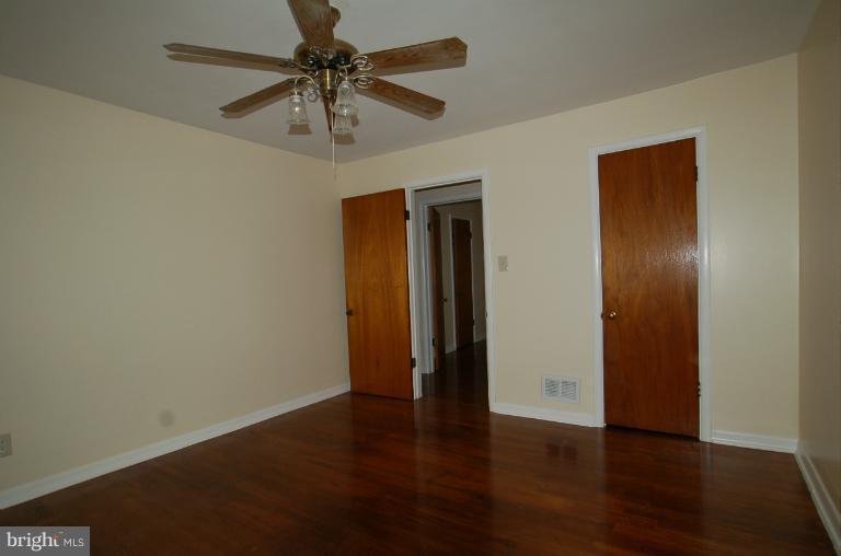 7909 Clark Station Road Severn, MD 21144 - Photo 11 of 11 a view of an empty room with a fan and a fan