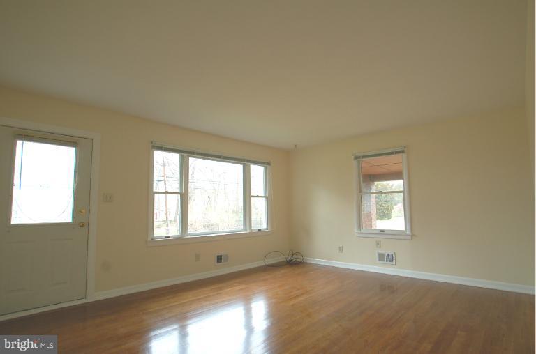 7909 Clark Station Road Severn, MD 21144 - Photo 6 of 11 a view of an empty room with a window
