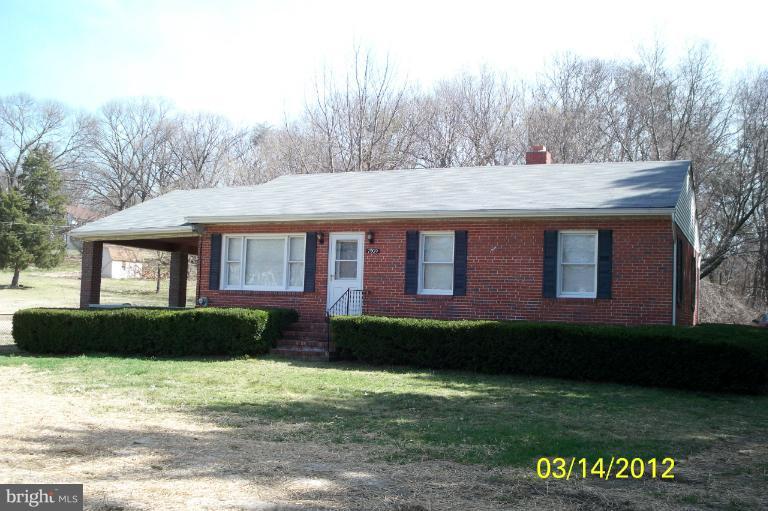 7909 Clark Station Road Severn, MD 21144 - Photo 8 of 11 a front view of a house with a garden