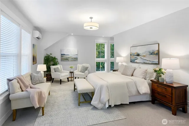 a bedroom with a bed and windows