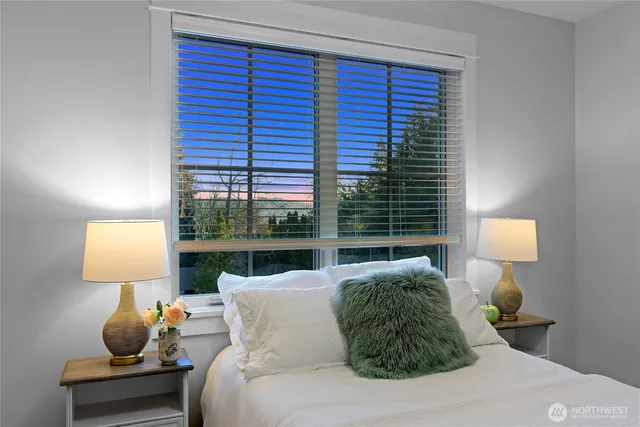 a living room with furniture and a lamp