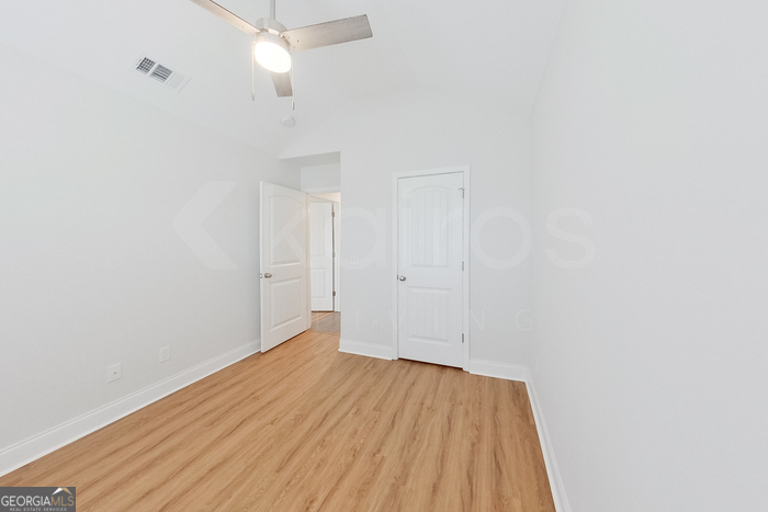 231 Western Red Cedar Drive Springfield, GA 31329 - Photo 17 of 26 a view of an empty room with wooden floor