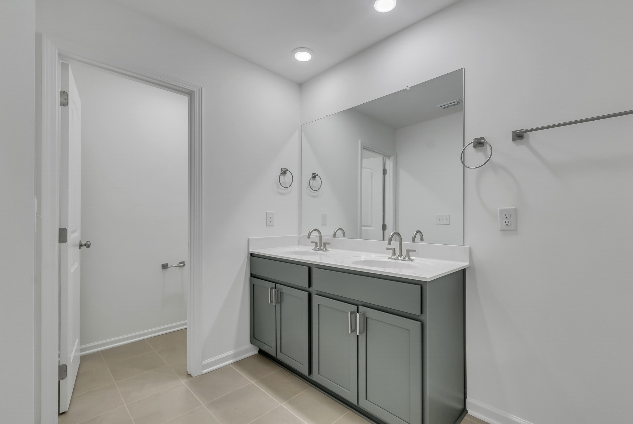168 Millbrook Drive Spring Hill, TN 37174 - Photo 3 of 13 a bathroom with a double vanity sink and mirror