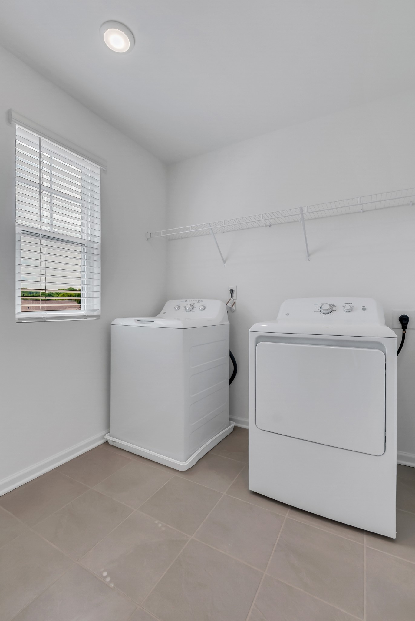 168 Millbrook Drive Spring Hill, TN 37174 - Photo 10 of 13 a utility room with dryer and washer