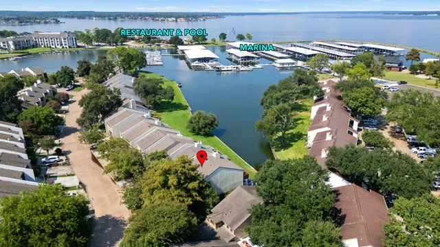 an aerial view of a houses with outdoor space