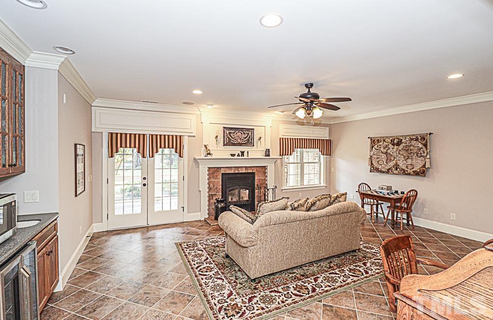 7400 Lancaster Store Road Spring Hope, NC 27882 - Photo 59 of 86 a living room with furniture and a fireplace