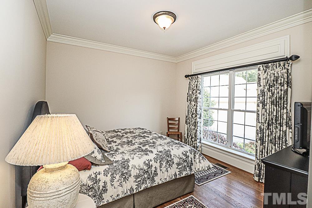 7400 Lancaster Store Road Spring Hope, NC 27882 - Photo 64 of 86 a bedroom with a bed and a large window