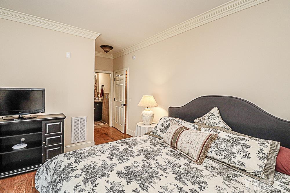 7400 Lancaster Store Road Spring Hope, NC 27882 - Photo 65 of 86 a bedroom with a bed and a flat screen tv