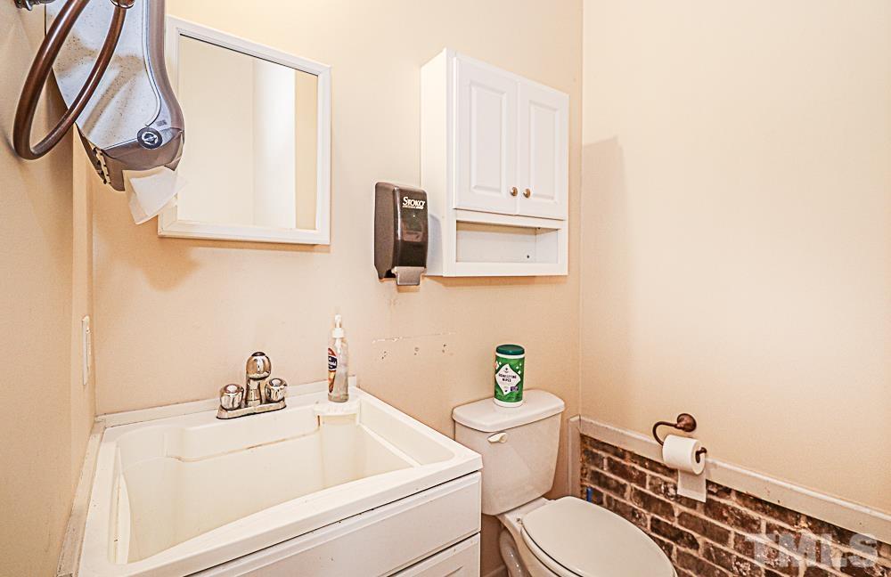 7400 Lancaster Store Road Spring Hope, NC 27882 - Photo 81 of 86 a bathroom with a sink a toilet and mirror