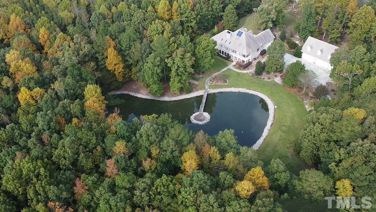 7400 Lancaster Store Road Spring Hope, NC 27882 - Photo 10 of 86 an aerial view of a house with a yard and trees