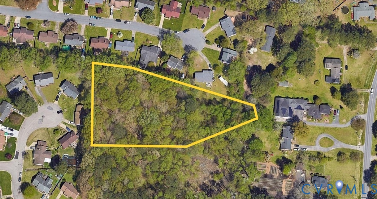 an aerial view of residential house with outdoor space and swimming pool