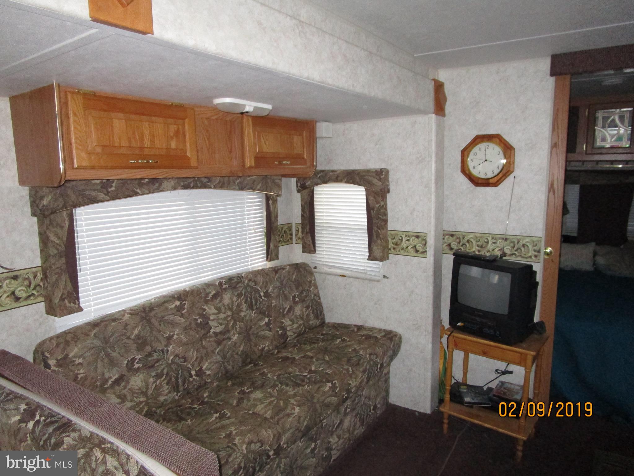 220 Boo Boo Boulevard Falling Waters, WV 25419 - Photo 11 of 14 Travel trailer sitting area