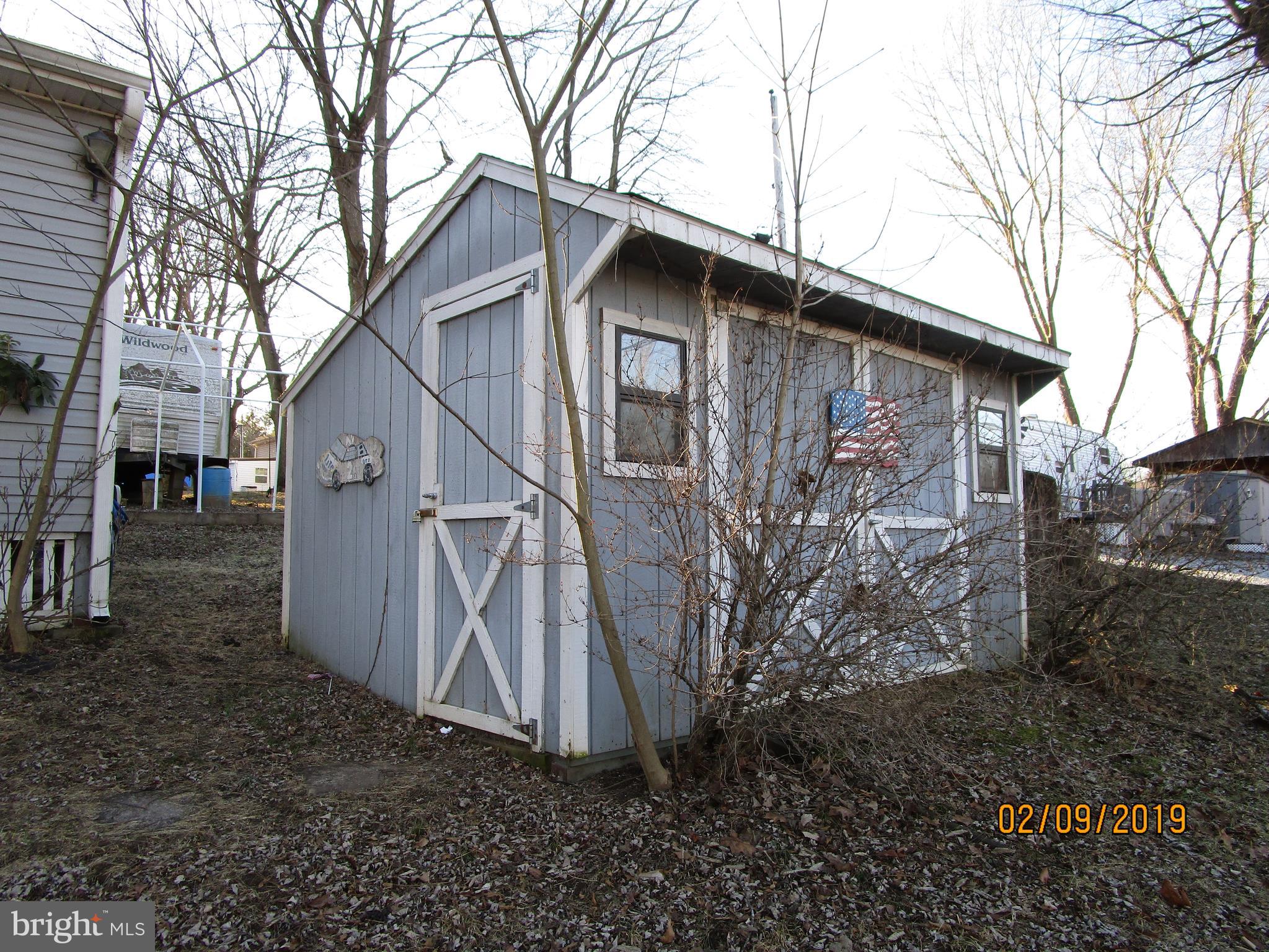 220 Boo Boo Boulevard Falling Waters, WV 25419 - Photo 6 of 14 Shed holding golf cart