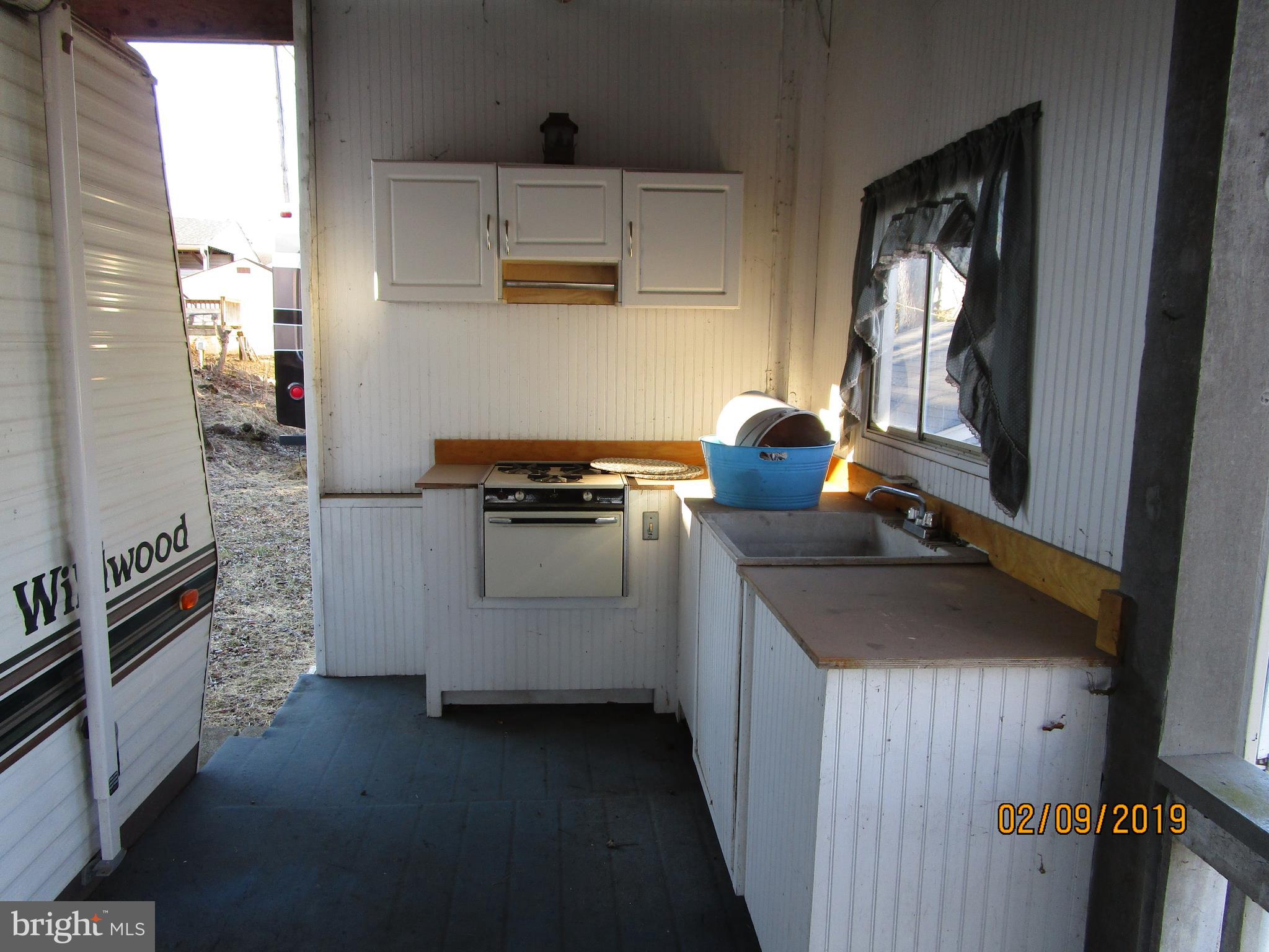 220 Boo Boo Boulevard Falling Waters, WV 25419 - Photo 7 of 14 Deck cooking area in front of travel trailer
