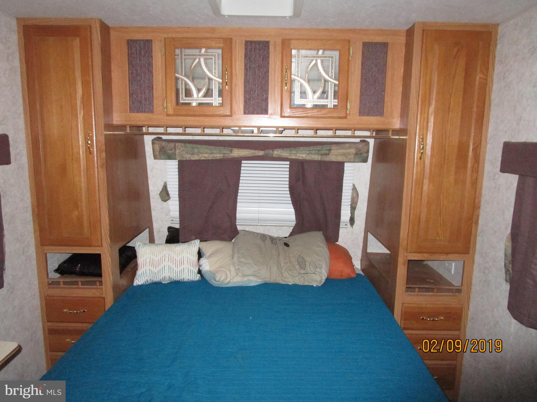 220 Boo Boo Boulevard Falling Waters, WV 25419 - Photo 9 of 14 Travel trailer bedroom