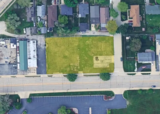 an aerial view of a house with a swimming pool