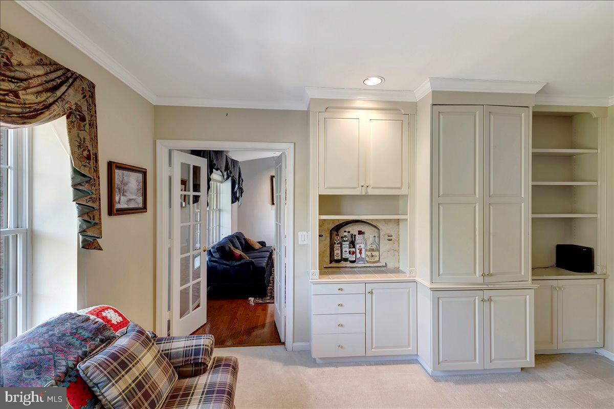 12310 Rosslare Ridge Road, Unit 501 Lutherville-Timonium, MD 21093 - Photo 19 of 43 French doors to den with custom built-ins