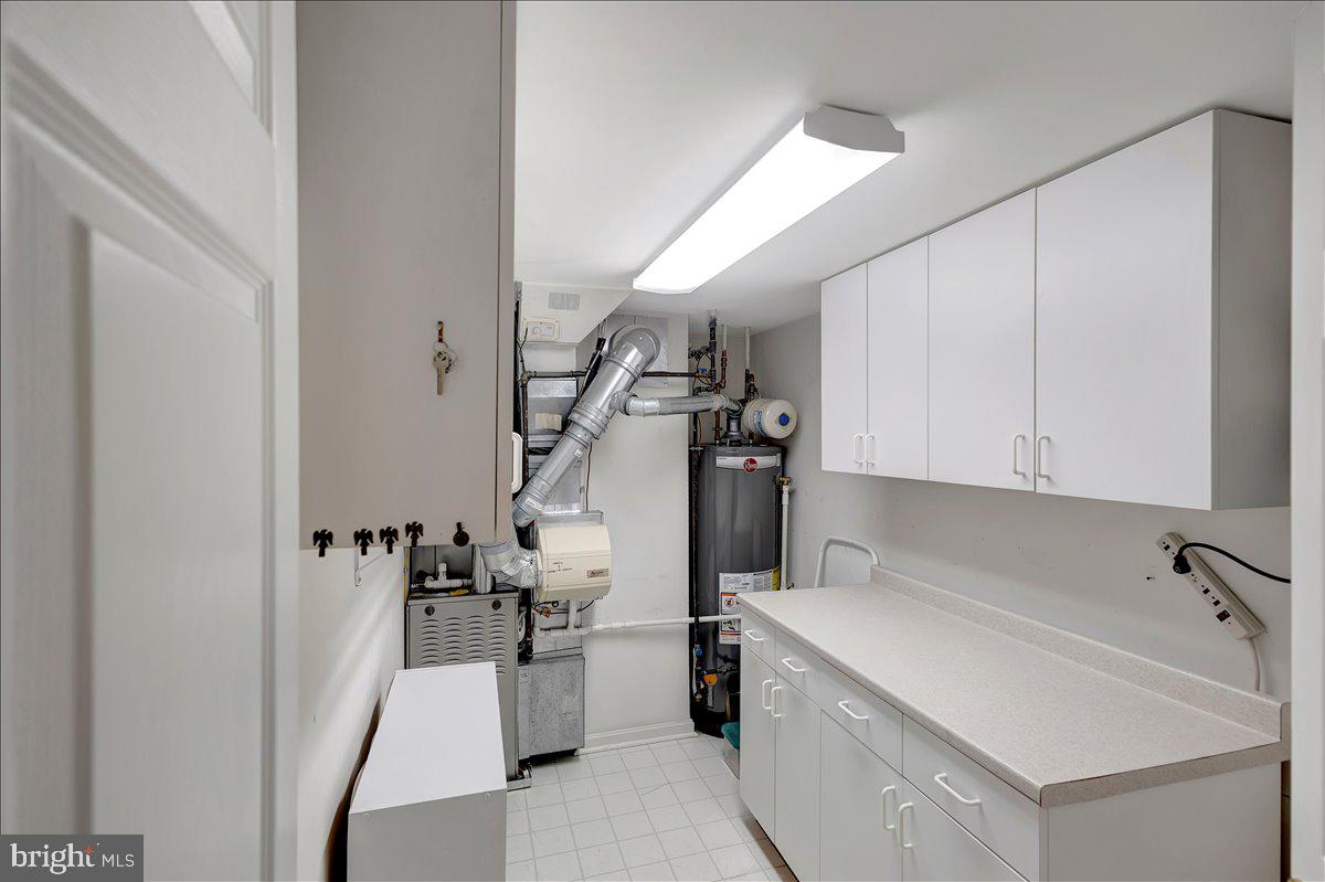 12310 Rosslare Ridge Road, Unit 501 Lutherville-Timonium, MD 21093 - Photo 37 of 43 Utility room houses HVAC and HWH & storage