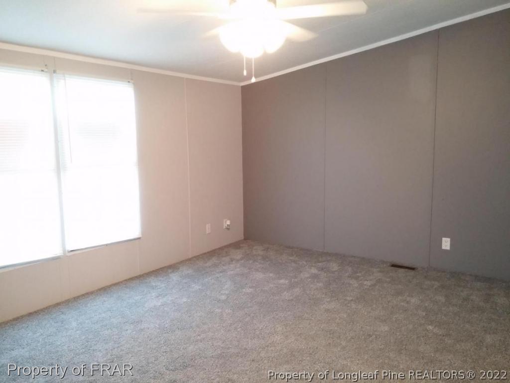 358 Capel Mill Road Candor, NC 27229 - Photo 4 of 11 a view of an empty room with a window