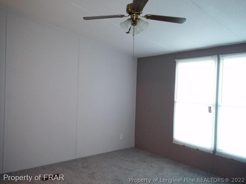 358 Capel Mill Road Candor, NC 27229 - Photo 5 of 11 a view of an empty room and a window