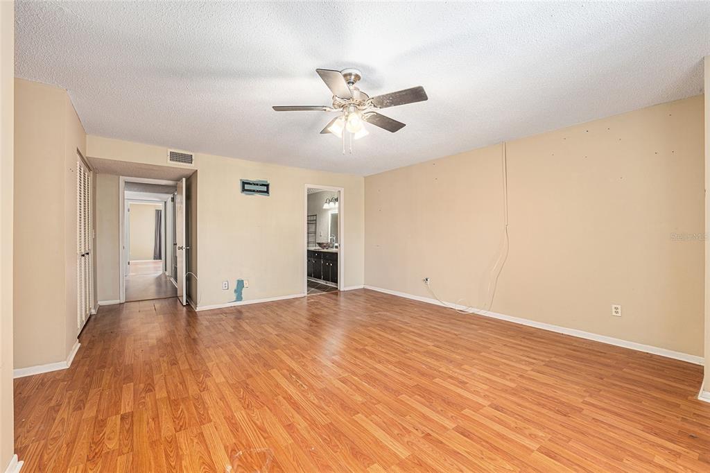 9951 Southwest 88th Court Road, Unit C Ocala, FL 34481 - Photo 23 of 46 a view of empty room with wooden floor