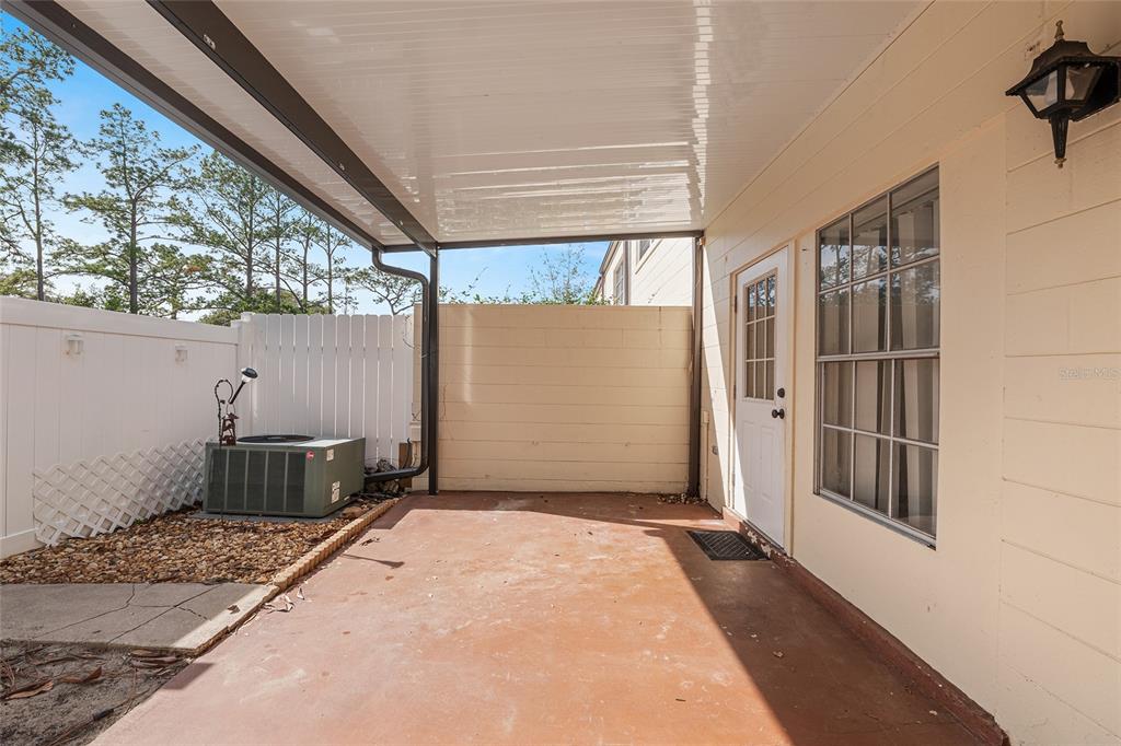 9951 Southwest 88th Court Road, Unit C Ocala, FL 34481 - Photo 36 of 46 a view of backyard with cabin