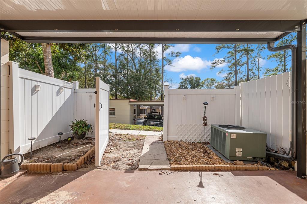 9951 Southwest 88th Court Road, Unit C Ocala, FL 34481 - Photo 38 of 46 a view of a porch with furniture and floor to ceiling window