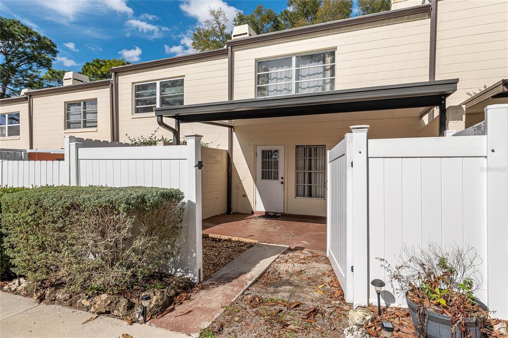 9951 Southwest 88th Court Road, Unit C Ocala, FL 34481 - Photo 39 of 46 a front view of a house with garden