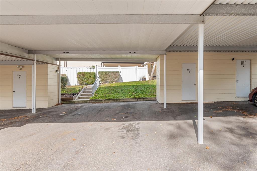 9951 Southwest 88th Court Road, Unit C Ocala, FL 34481 - Photo 43 of 46 a view of a house with a yard and garage