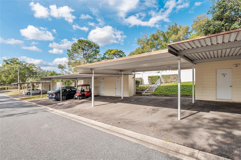 9951 Southwest 88th Court Road, Unit C Ocala, FL 34481 - Photo 44 of 46 a view of a house with a patio