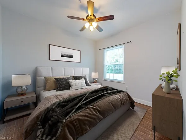 a bedroom with a bed and a window