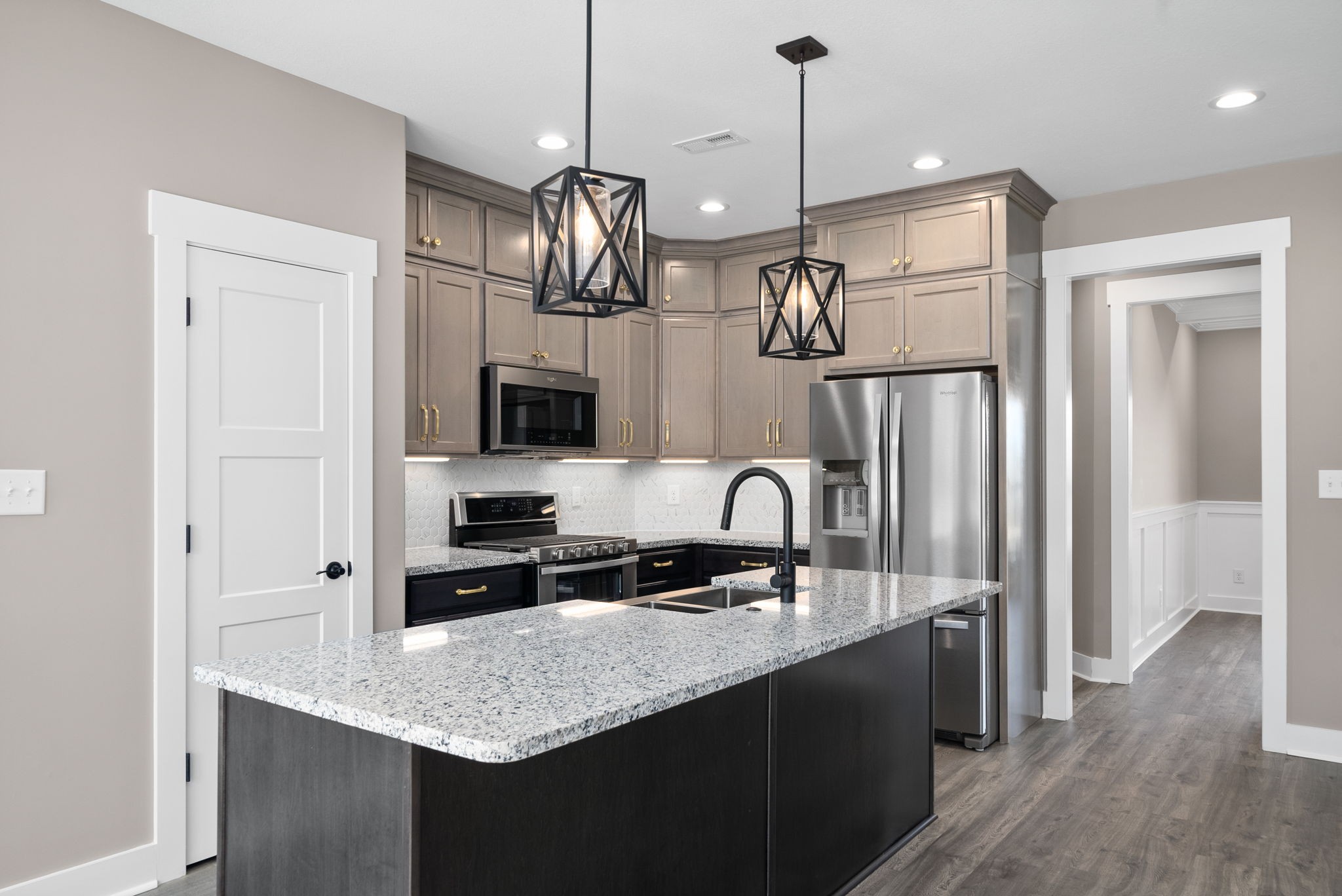 1059 Gratton Road Clarksville, TN 37043 - Photo 12 of 45 a kitchen with stainless steel appliances granite countertop a sink a microwave a refrigerator and a wooden floor