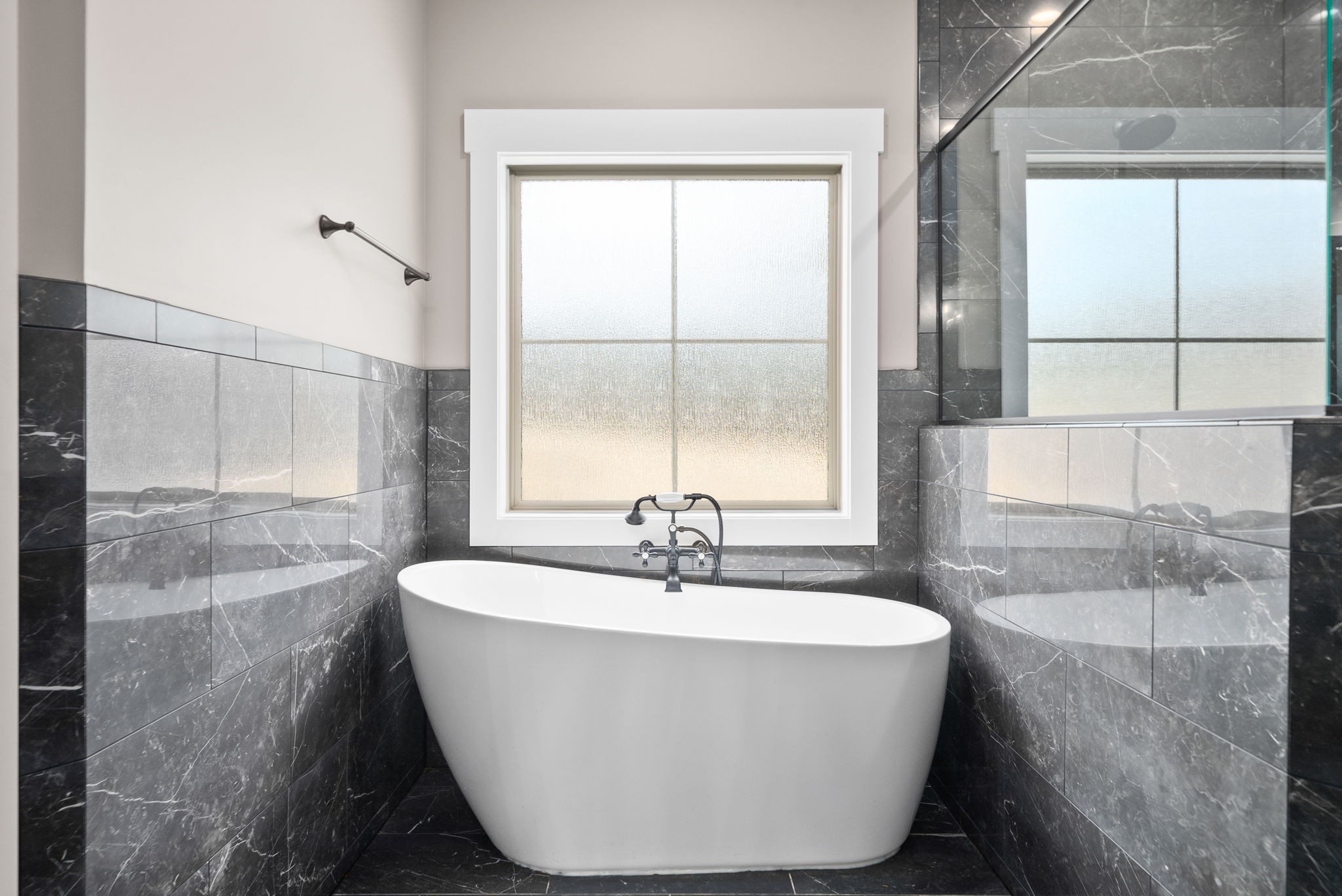 1059 Gratton Road Clarksville, TN 37043 - Photo 30 of 45 a white bath tub sitting in a bathroom next to a window