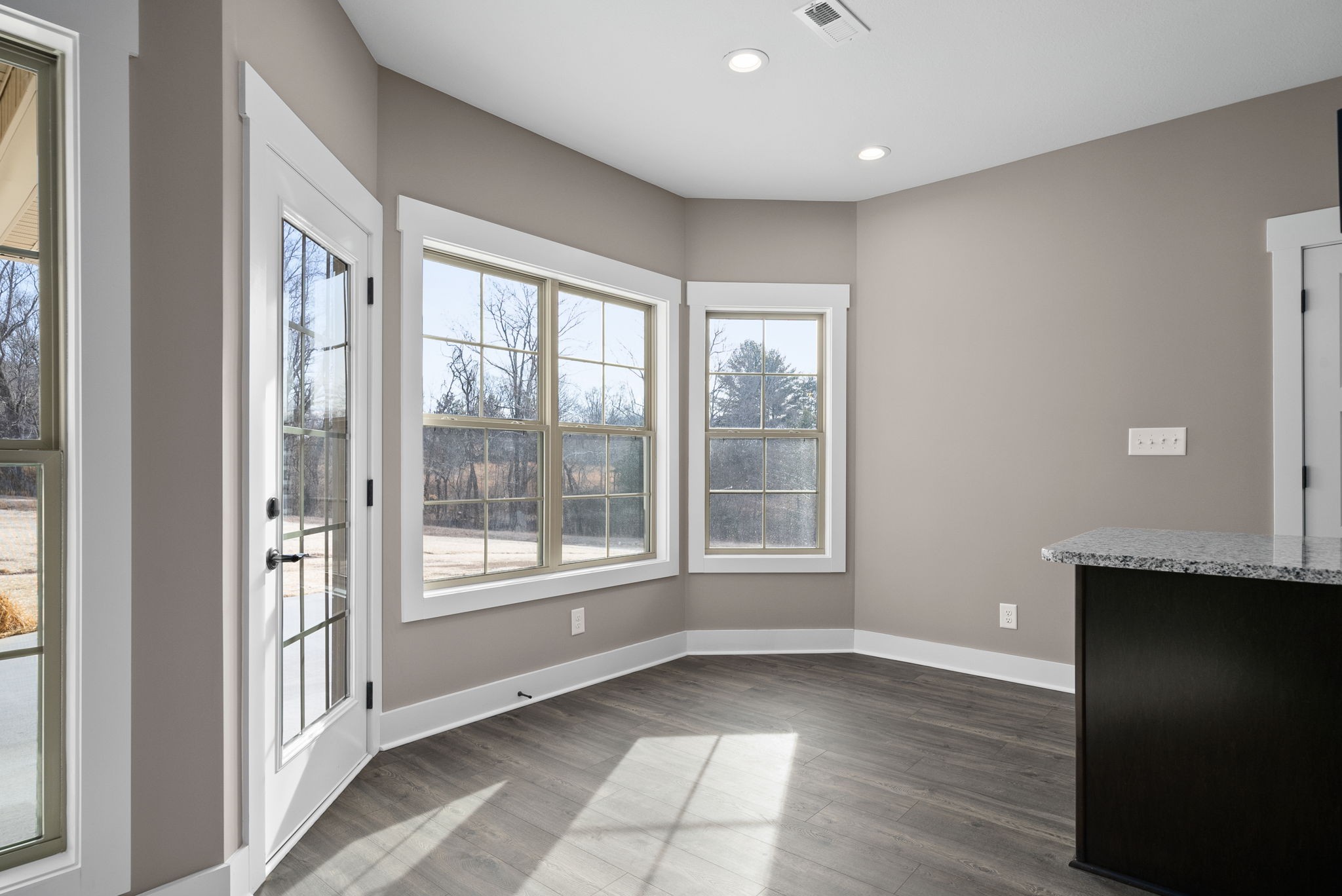 1059 Gratton Road Clarksville, TN 37043 - Photo 10 of 45 a view of an empty room with a window and wooden floor